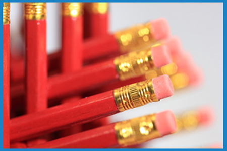 neatly stacked red pencils