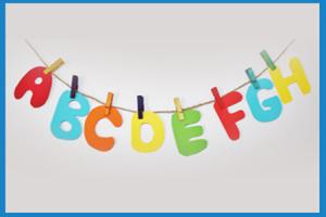 string with colourful paper cut outs of the alphabet clipped on