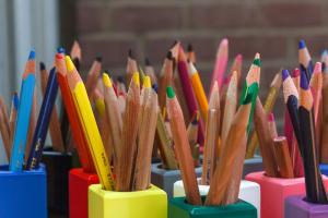 colourful pencils in colourful pots